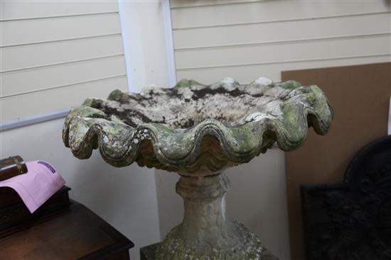 A large weathered stone garden urn, W.3ft 5in. H.3ft 11in.